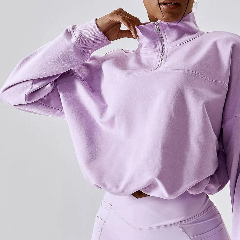 A cosy, oversized cotton pullover with a stylish zipper accent, perfect for casual autumn and winter wear.
