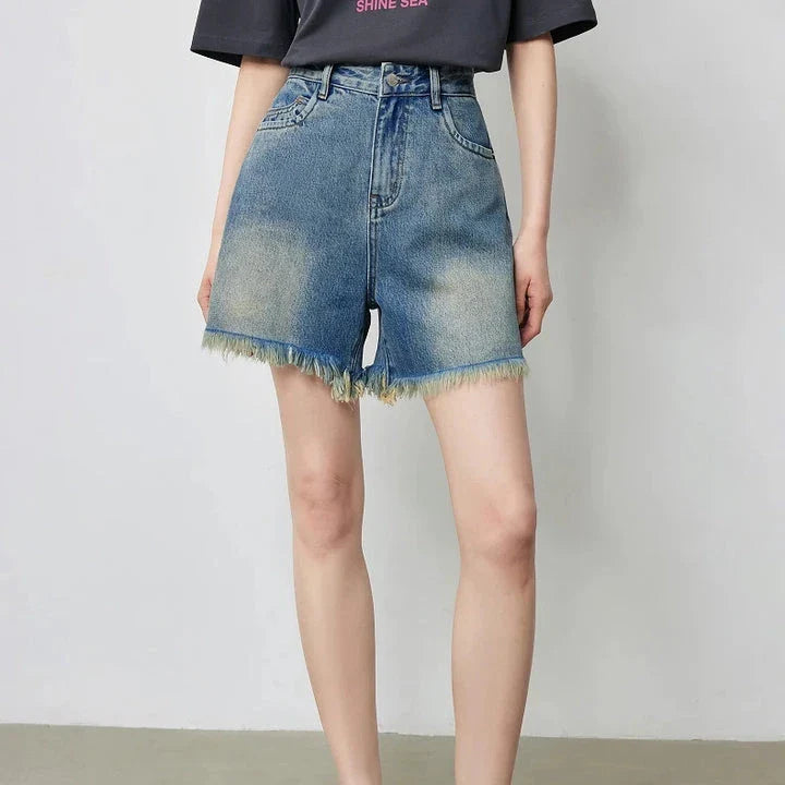 Vintage-inspired high-waisted denim shorts with tassel detailing for women