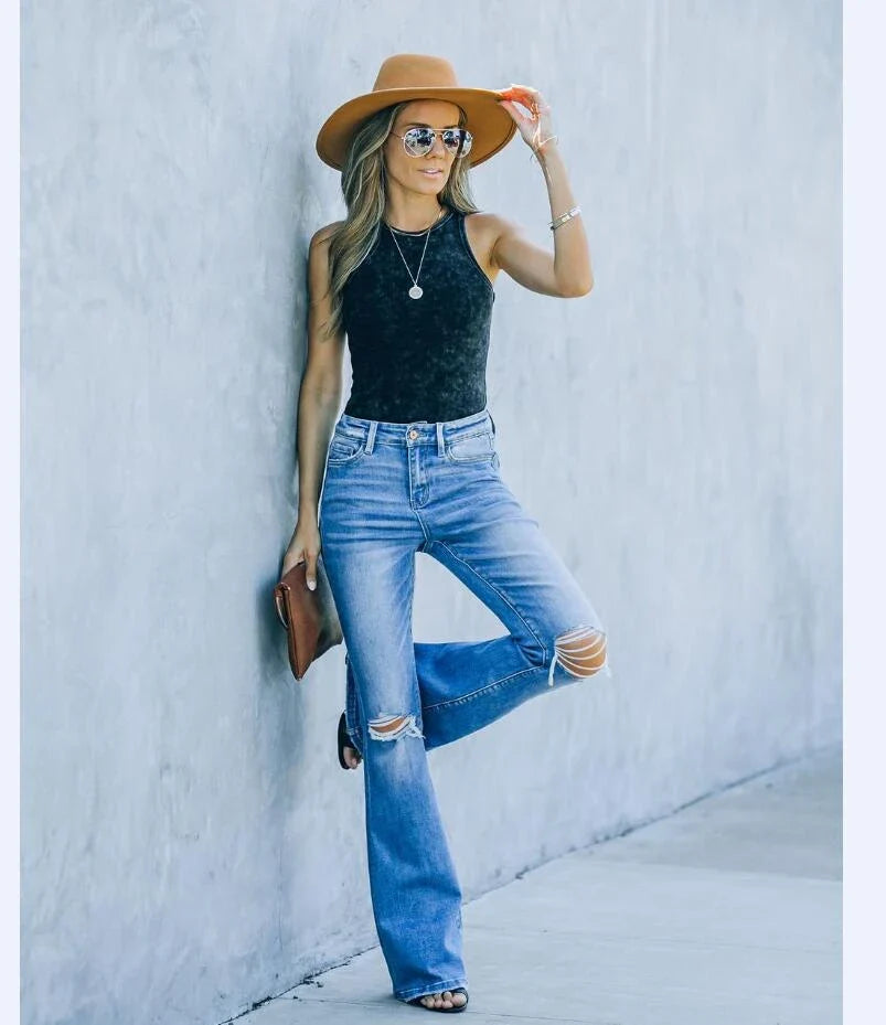 Premium distressed denim trousers for British women, featuring a high-waist silhouette and subtle ripped detailing