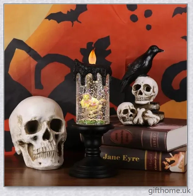 Candlite 10-inch Grand Glittering Halloween LED Candles with intricate designs of spiders, skulls, and other spooky elements