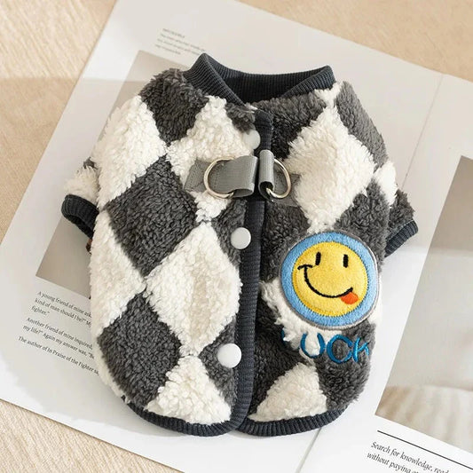 A stylish checkered fleece coat for small and medium-sized dogs, providing warmth and comfort during the chilly British autumn and winter seasons.