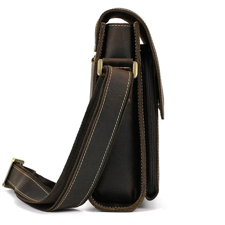 Premium leather crossbody bag with flap closure, vertical square shape, and multiple interior compartments