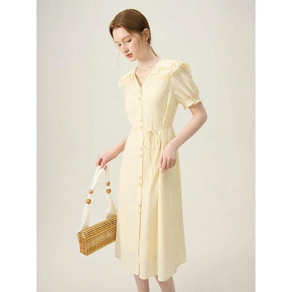 Elegant Navy Sailor Collar Dress with Signature Fungus-Edged Sleeves, a knee-length dress with a unique collar and delicate sleeve details