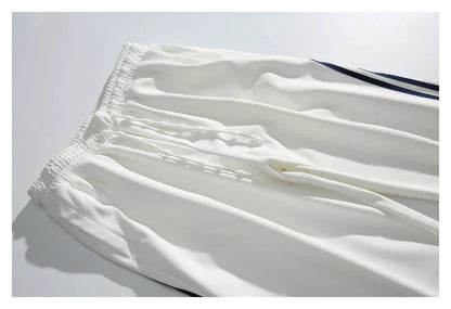Stylish striped sports trousers in a relaxed, mid-waist design for versatile leisure and athletic wear