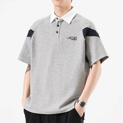 Melange grey polo shirt with contrast stitching, designed and made in Britain for comfortable summer wear