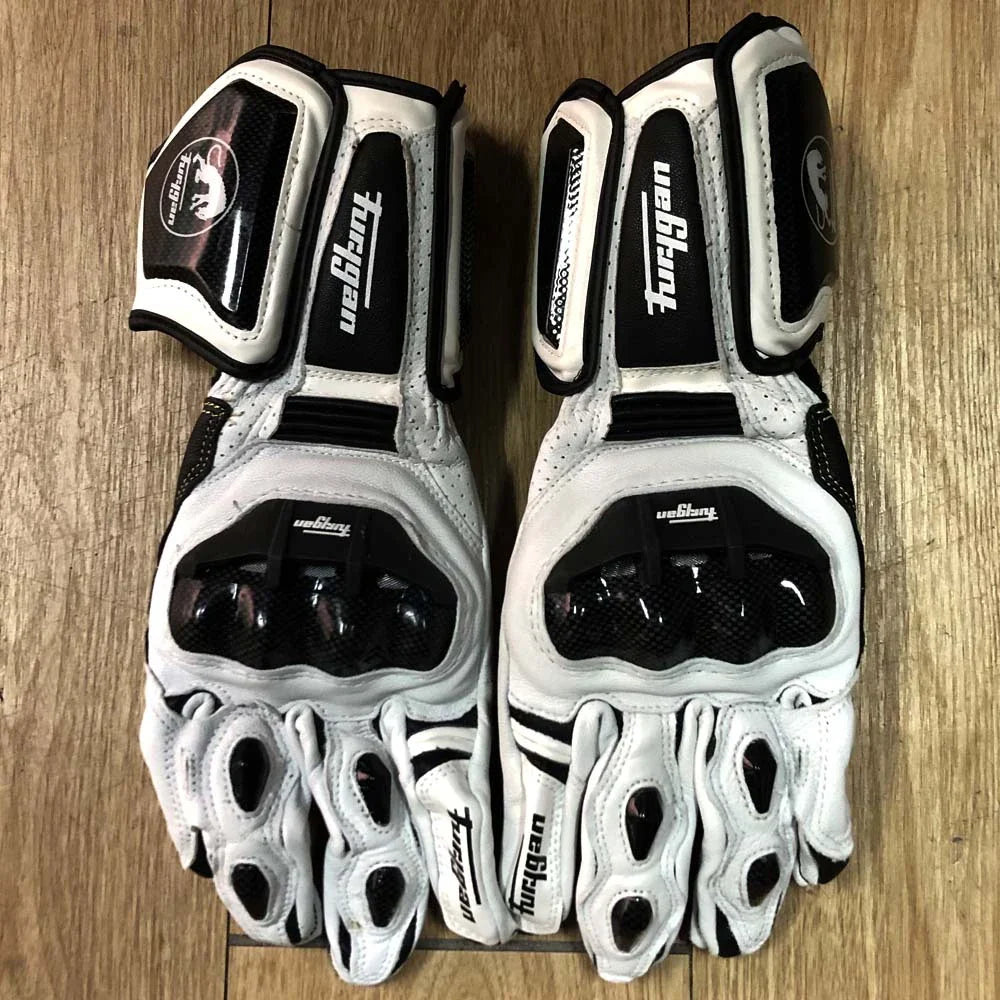 Premium motorcycle gloves made of leather and reinforced with carbon fibre for enhanced protection and breathability