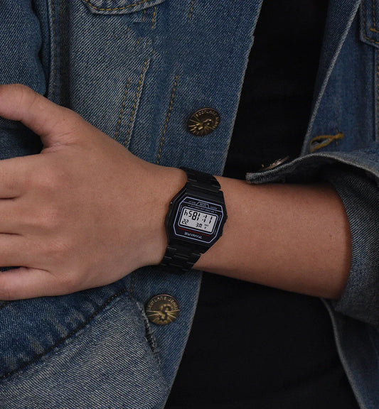 A stylish and retro-inspired gold watch with a sleek and compact design, featuring a luminous display and water resistance for everyday wear.