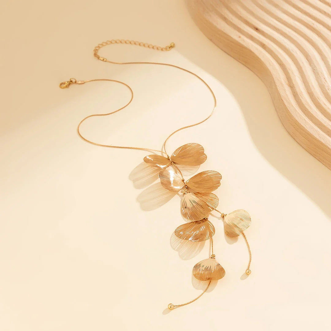 Elegant Kpop-inspired flower petal choker necklace in radiant gold colour, featuring a beautiful pendant and chic snake chain design
