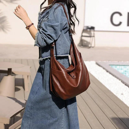 High-quality genuine leather crossbody hobo bag for women with a unique stone pattern and ample interior storage