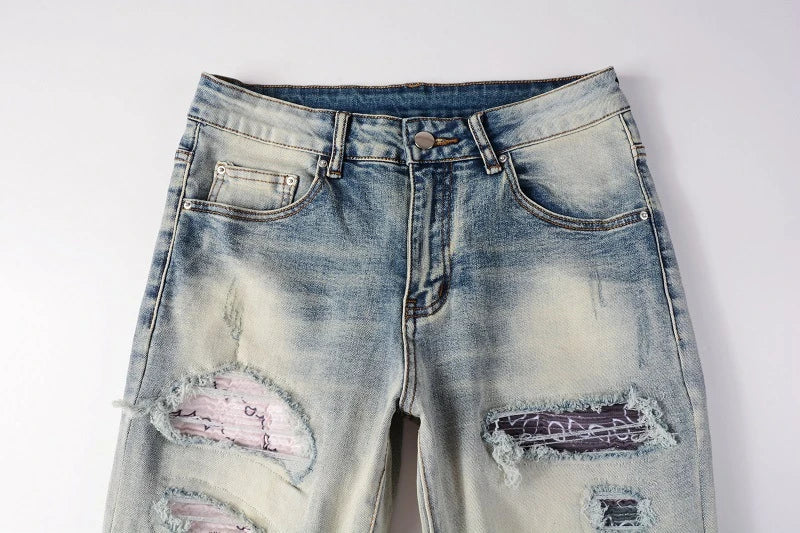 Stylish distressed denim jeans with a skinny, knee-exposed silhouette for a contemporary, high-street fashion look