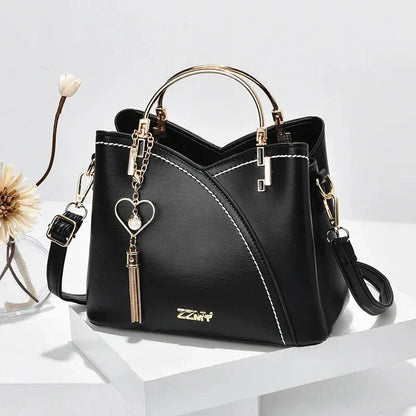 Sophisticated navy blue PU leather bucket crossbody bag with elegant patchwork design and adjustable strap