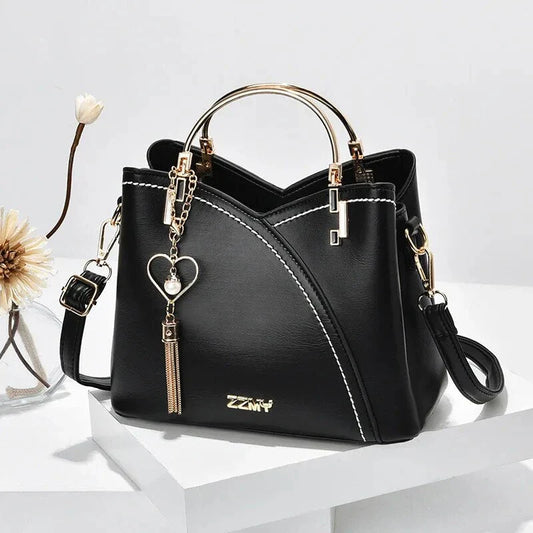 Sophisticated navy blue PU leather bucket crossbody bag with elegant patchwork design and adjustable strap