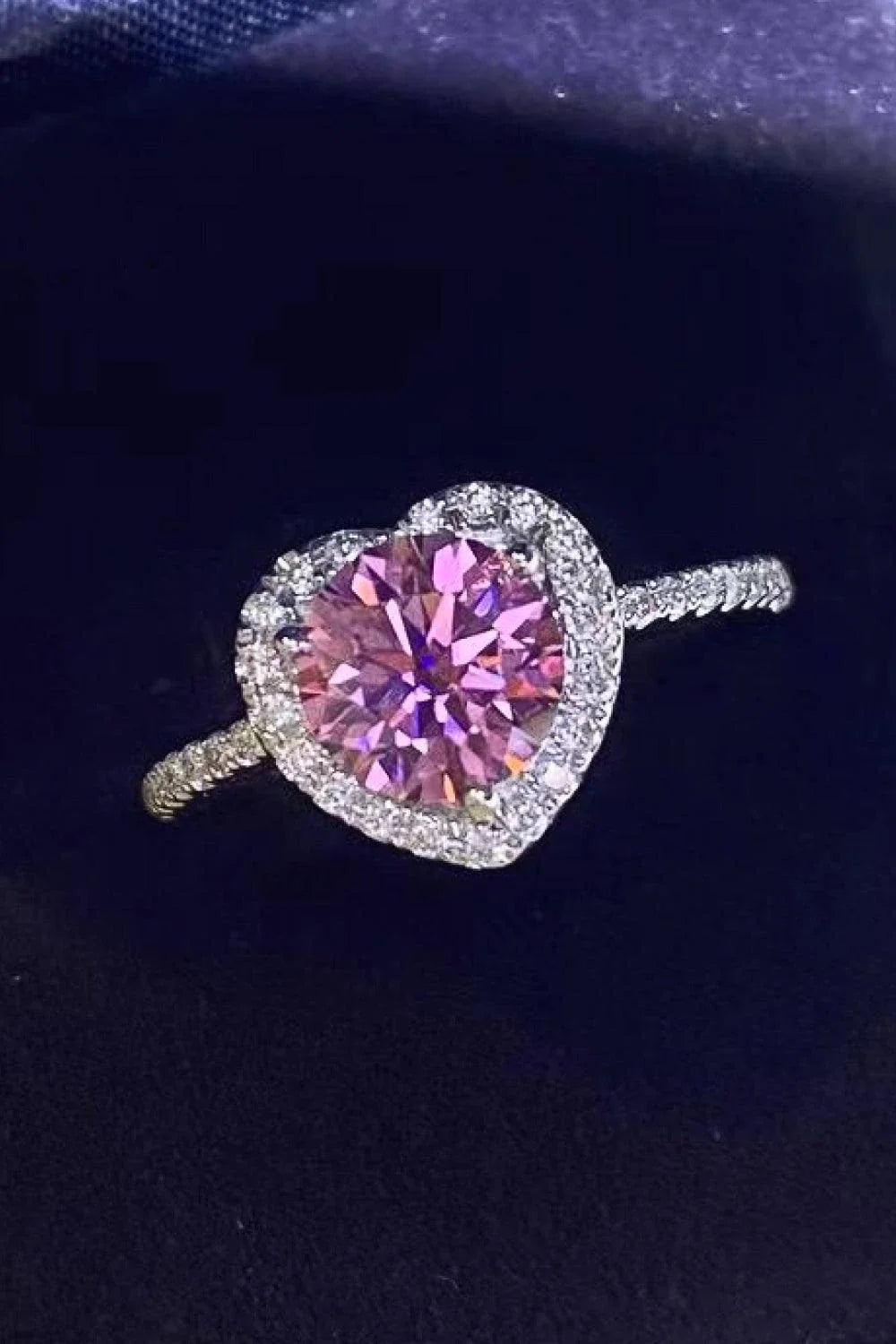 Elegant platinum-plated 925 sterling silver ring featuring a captivating 1 carat moissanite heart-shaped centre stone and sparkling zircon accents.