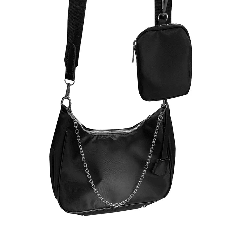 Stylish black crossbody bag with a British-inspired design, featuring a spacious interior and comfortable single-strap for hands-free convenience.