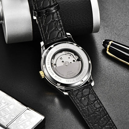 A sophisticated automatic mechanical watch with a gold/white or gold/black face, stainless steel case, and genuine leather strap
