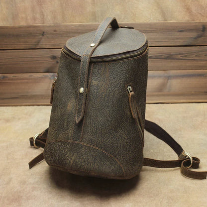 A premium Crazy Horse leather backpack with a classic bucket-style design and retro-inspired flair, perfect for the discerning urban adventurer.