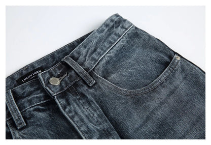 A pair of stylish retro-inspired Japanese jeans in black and grey, featuring a mid-rise waist and straight leg silhouette for a flattering, comfortable fit.