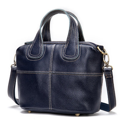 Premium leather shoulder bag for women in red, blue, and black colours with spacious interior and comfortable strap