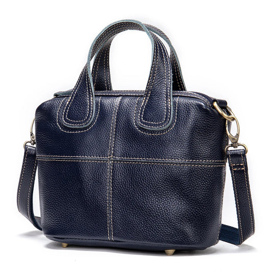 Premium leather shoulder bag for women in red, blue, and black colours with spacious interior and comfortable strap