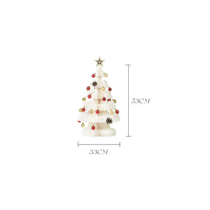 A beautifully crafted origami Christmas tree decoration in a Nordic-inspired style, with a warm, glowing illumination