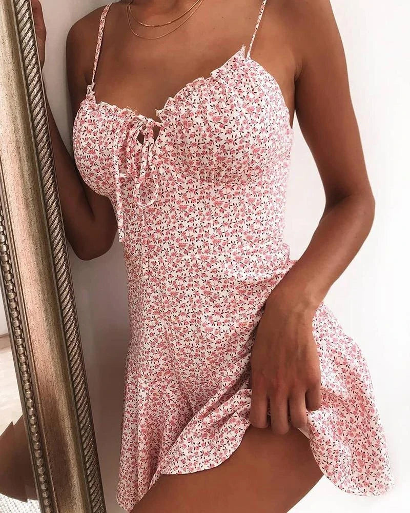 Floral mini dress with vibrant prints, soft polyester fabric, and a flattering silhouette for a stylish look.