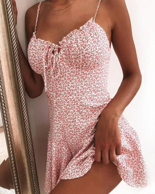 Floral mini dress with vibrant prints, soft polyester fabric, and a flattering silhouette for a stylish look.