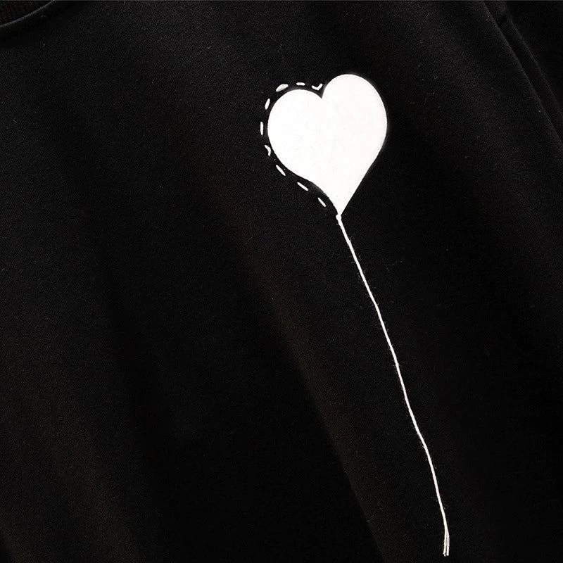 A premium ladies' round neck pullover in a versatile black colour, made from high-quality cotton for exceptional softness and comfort.