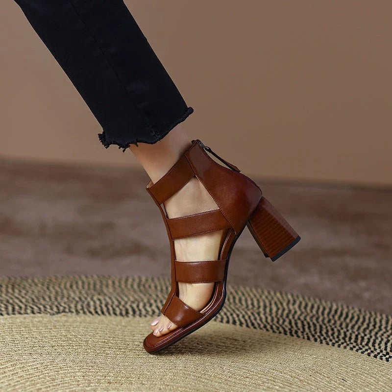 Luxurious leather gladiator sandals with square heel and buckle strap, providing style and comfort for any occasion.