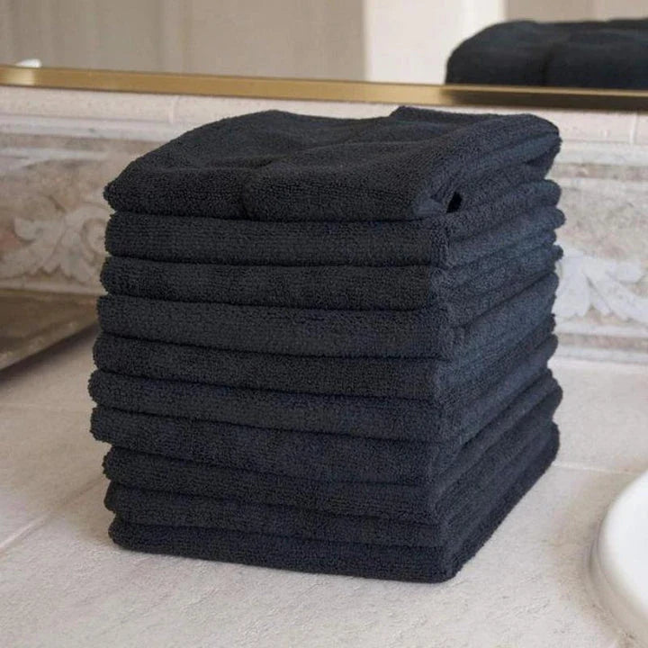 Premium microfibre salon towels in black, featuring a large size, lightweight and highly absorbent design for efficient hair drying