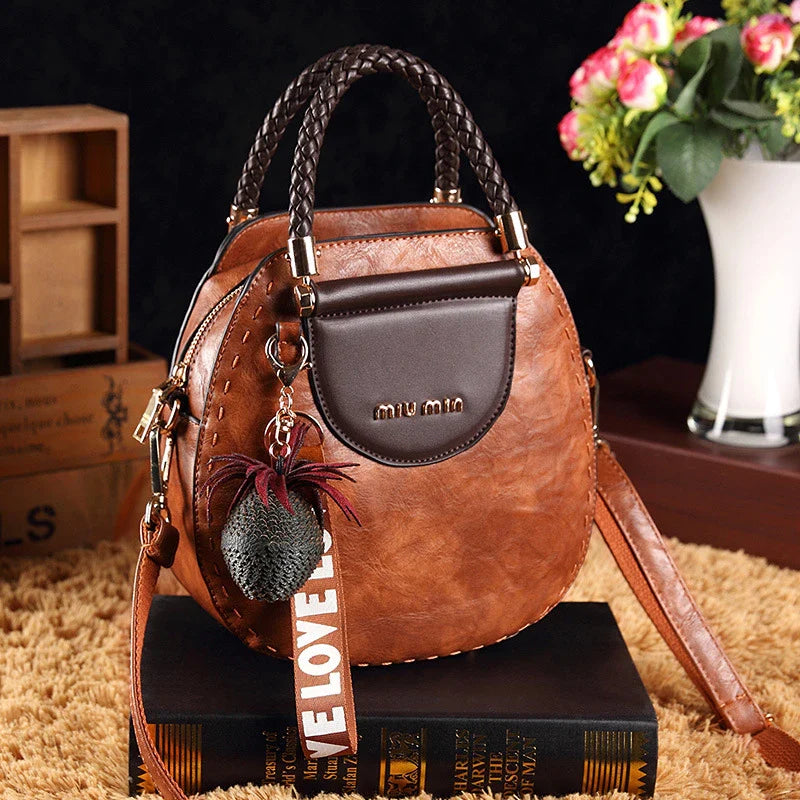 Fashionable women's one-shoulder diagonal bag in caramel, nude pink, black, wine red, and retro brown colours