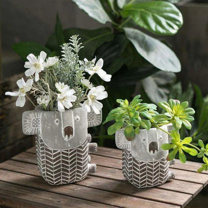 Charming retro koala-shaped cement planter for succulents and small flowers, available in two sizes