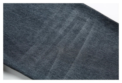 A pair of stylish retro-inspired Japanese jeans in black and grey, featuring a mid-rise waist and straight leg silhouette for a flattering, comfortable fit.