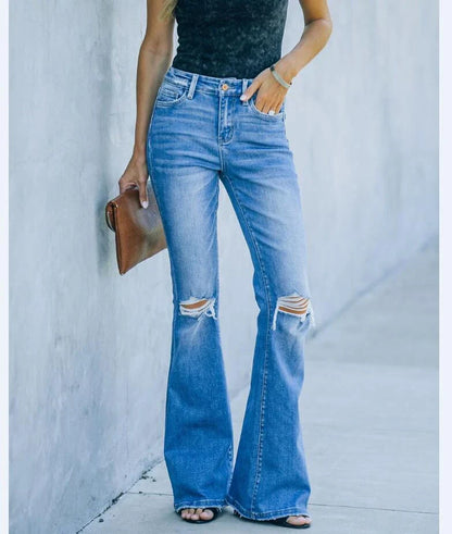 Premium distressed denim trousers for British women, featuring a high-waist silhouette and subtle ripped detailing