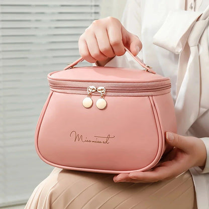 Luxurious waterproof makeup organiser with spacious design, waterproof materials, and convenient carry handle for travel use