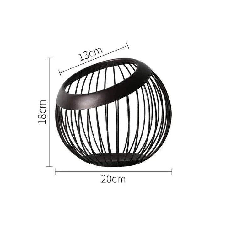Black Nordic-style metal drain basket with perforated design for efficient drainage