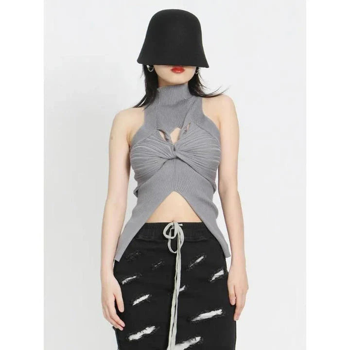 Elegant and versatile knitted sleeveless tank top with a unique hollow-out design, perfect for chic British style