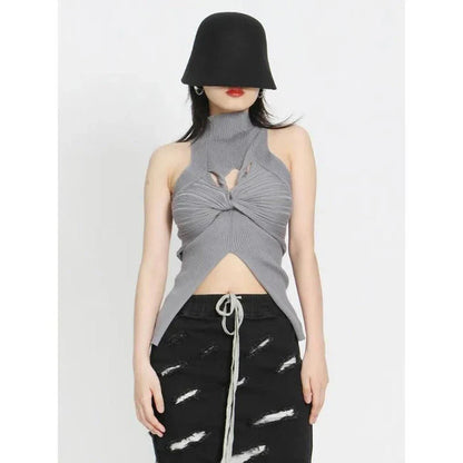 Elegant and versatile knitted sleeveless tank top with a unique hollow-out design, perfect for chic British style