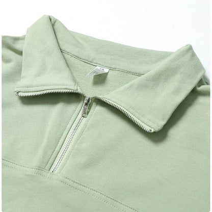A cosy, oversized cotton pullover with a stylish zipper accent, perfect for casual autumn and winter wear.