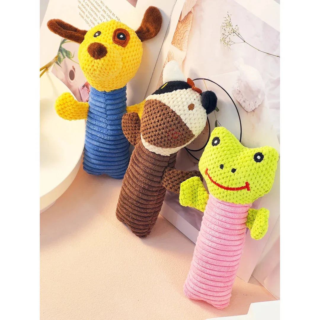 Interactive plush dog toys in the shape of corn kernels and dog figures, made of soft fleece material with built-in squeakers for endless playtime fun.