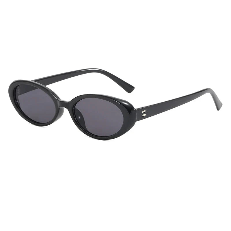 Oval-shaped women's sunglasses in a white and grey colour, offering UV protection and a stylish, retro-inspired design.