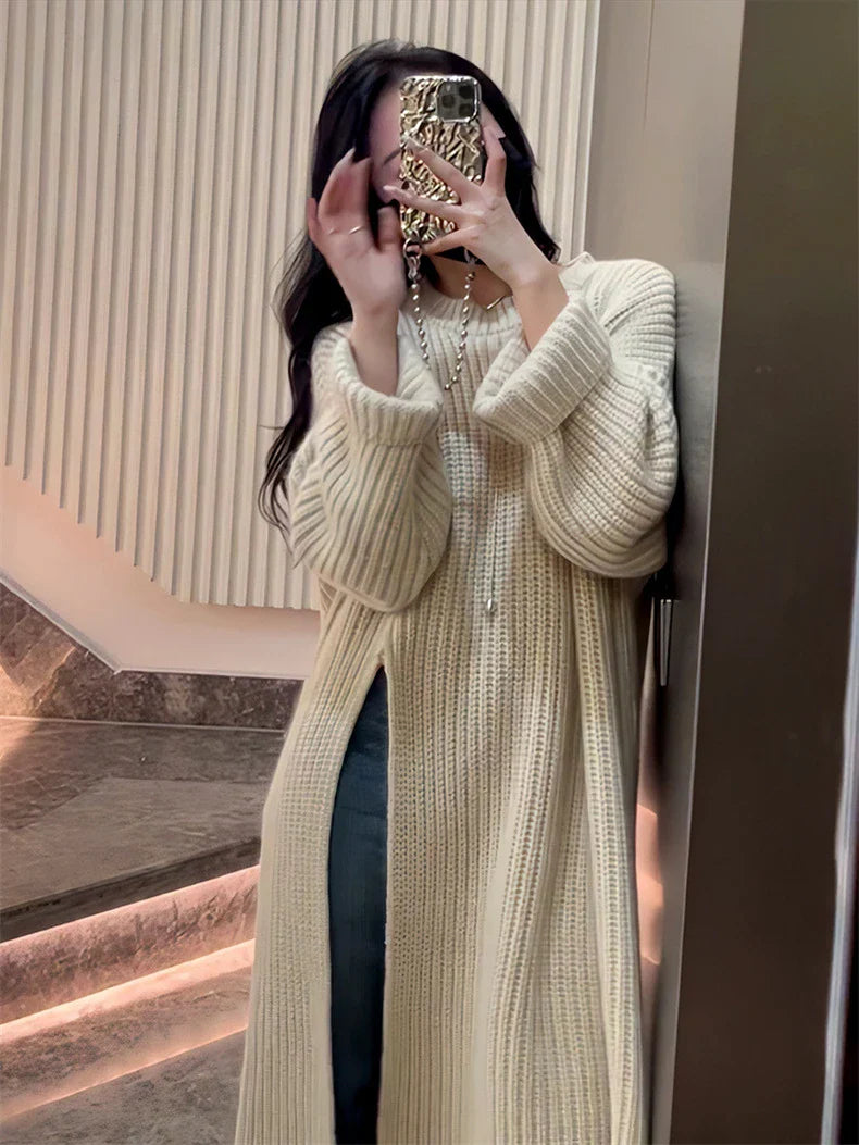 Relaxed mid-length jumper dress in a variety of colours, featuring an A-line silhouette and premium knit fabric for a comfortable, flattering fit.