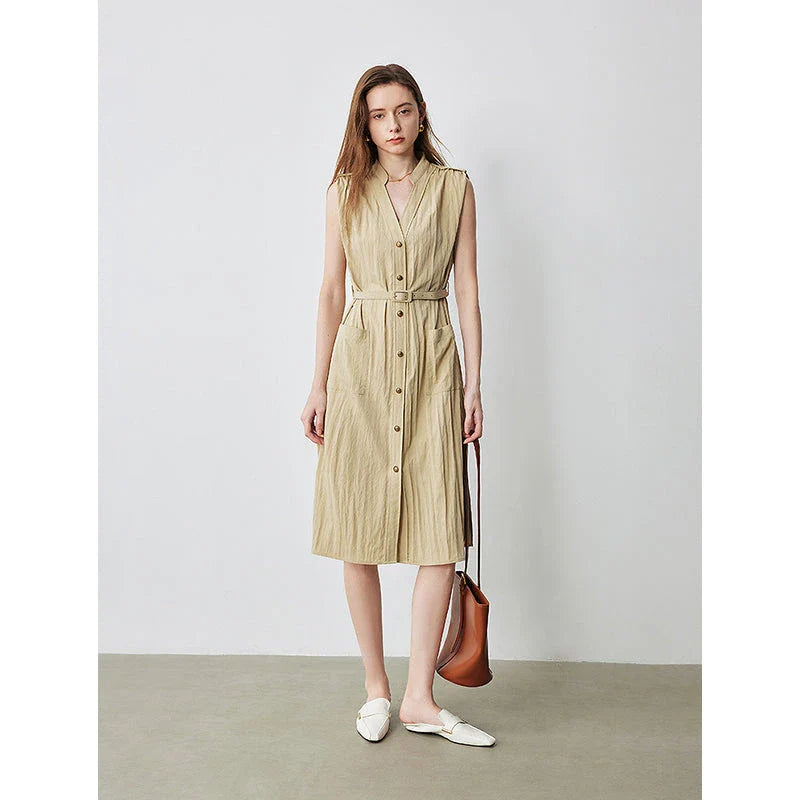 Elegant sleeveless midi shirt dress with V-neck and side pockets, perfect for summer in the UK