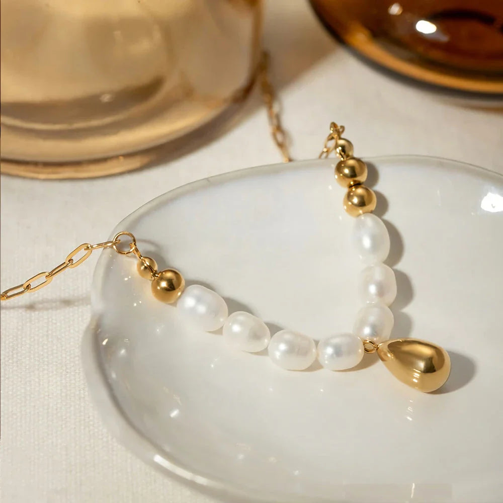 Elegant pearl pendant necklace with luxurious gold drop, a timeless accessory for any occasion