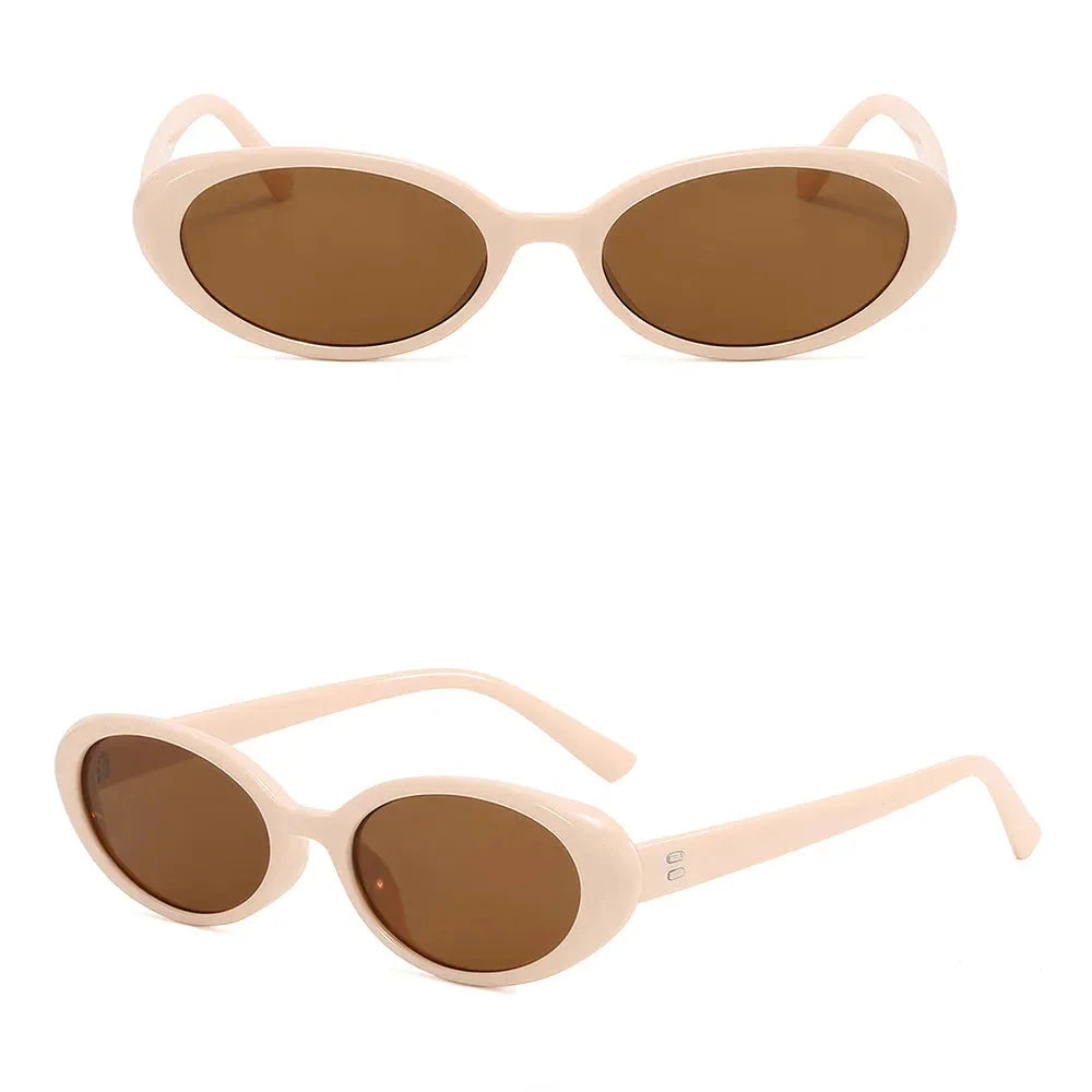 Oval-shaped women's sunglasses in a white and grey colour, offering UV protection and a stylish, retro-inspired design.