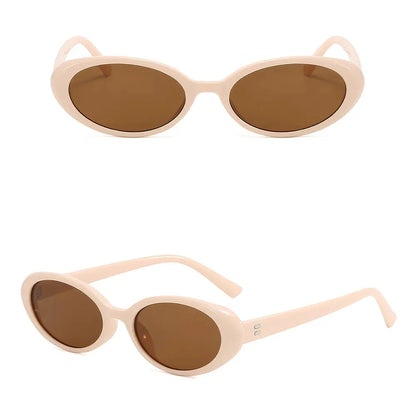 Oval-shaped women's sunglasses in a white and grey colour, offering UV protection and a stylish, retro-inspired design.