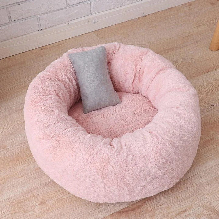Cosy and comfortable fleece round cat bed in pink colour, perfect for your beloved feline friend to relax and unwind.