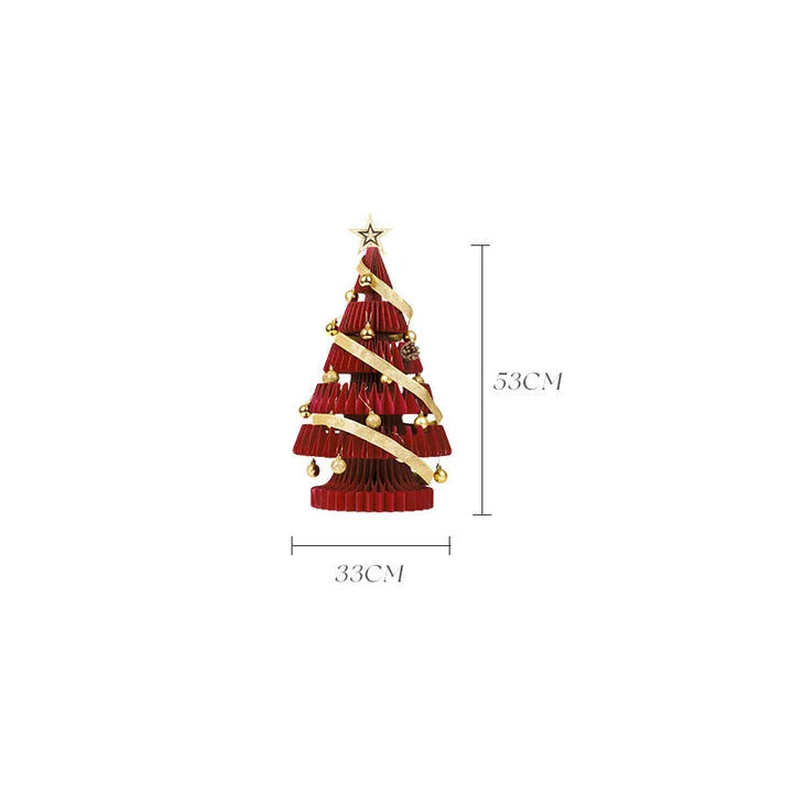 A beautifully crafted origami Christmas tree decoration in a Nordic-inspired style, with a warm, glowing illumination