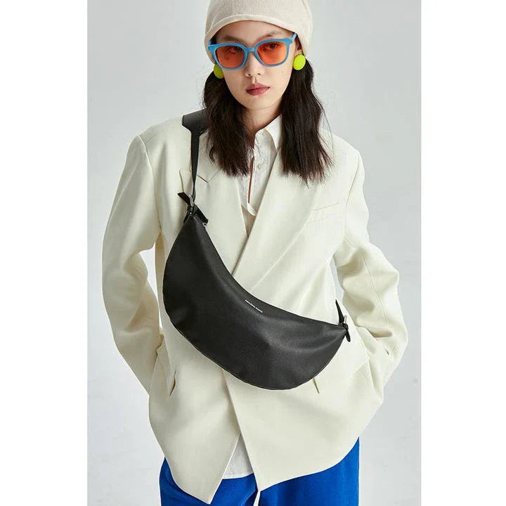 Stylish leather crossbody fanny pack with vintage half-moon design, perfect for everyday use in the UK