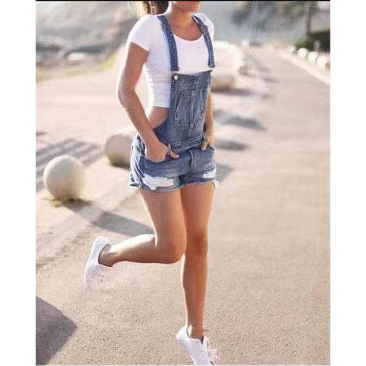 Premium British-made denim overalls shorts in classic blue hues, featuring adjustable suspenders for a tailored fit