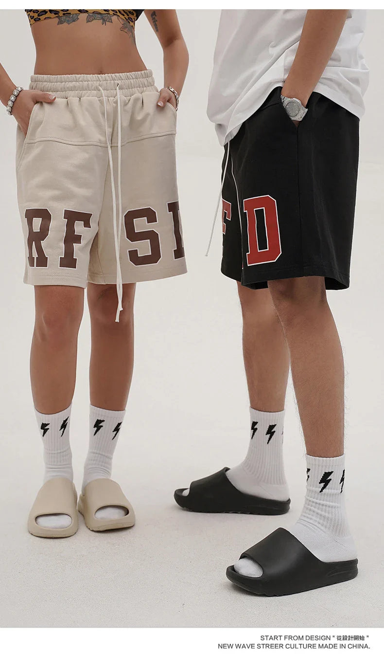 Premium loose-fit sports shorts with eye-catching printed patterns in black, khaki, and dark grey colours